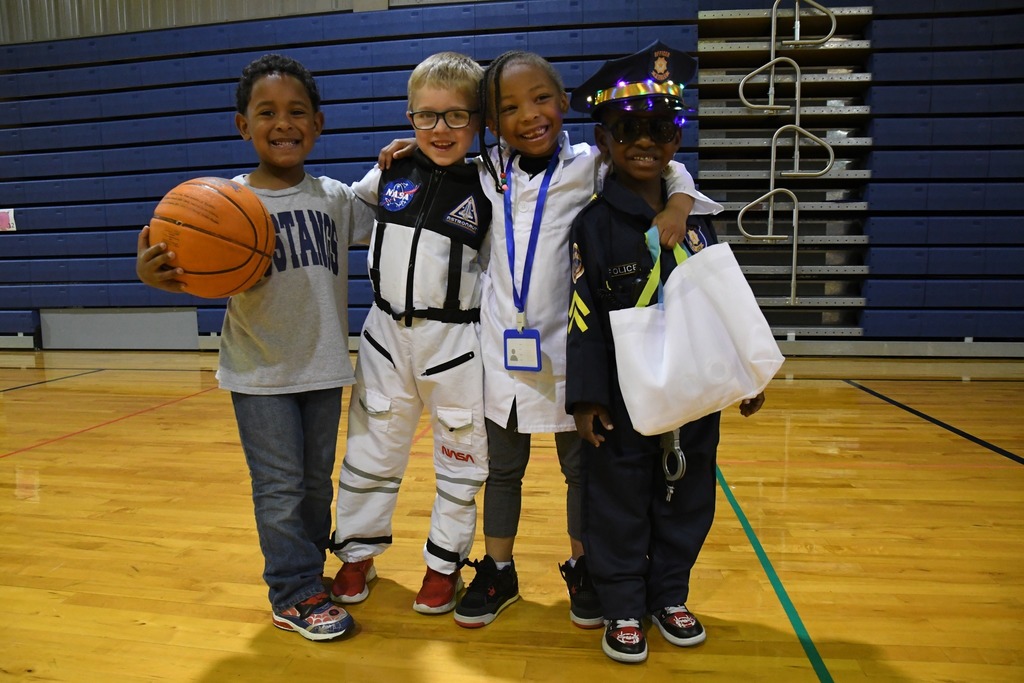4 students dressed up for the career parade