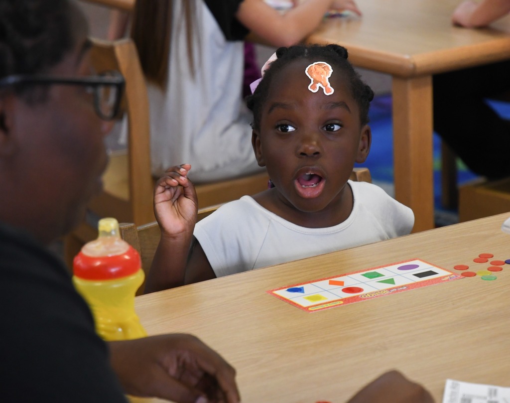 student playing shape bingo making a shocked face