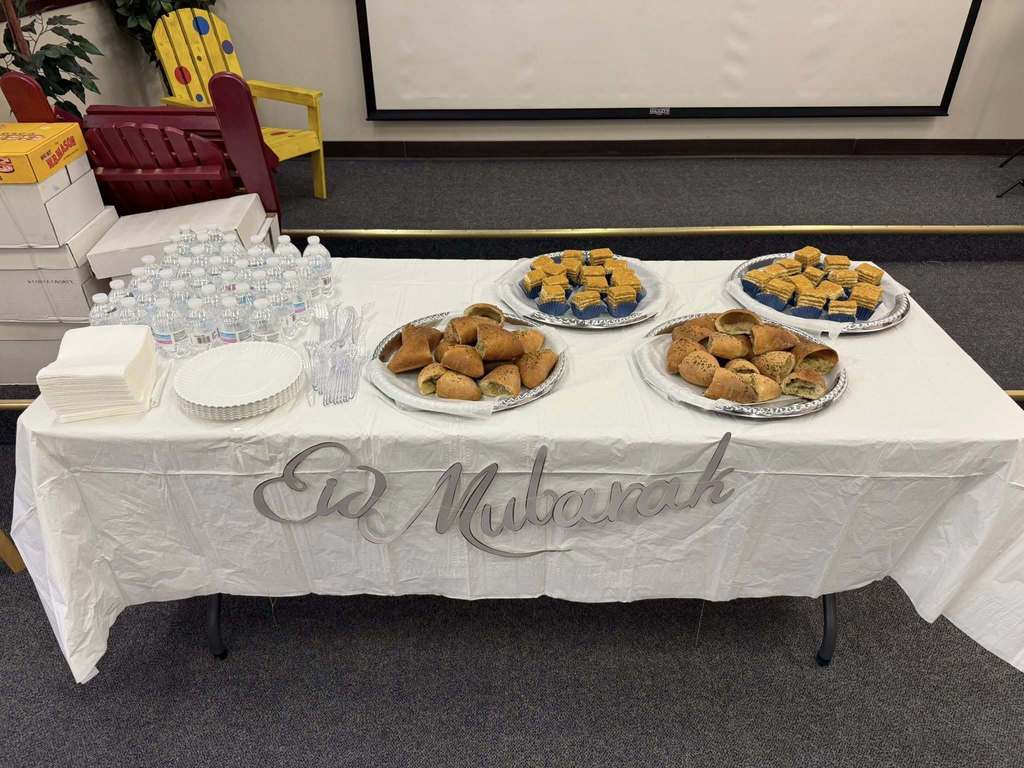 Food on a table that says "Eid Mubarek".