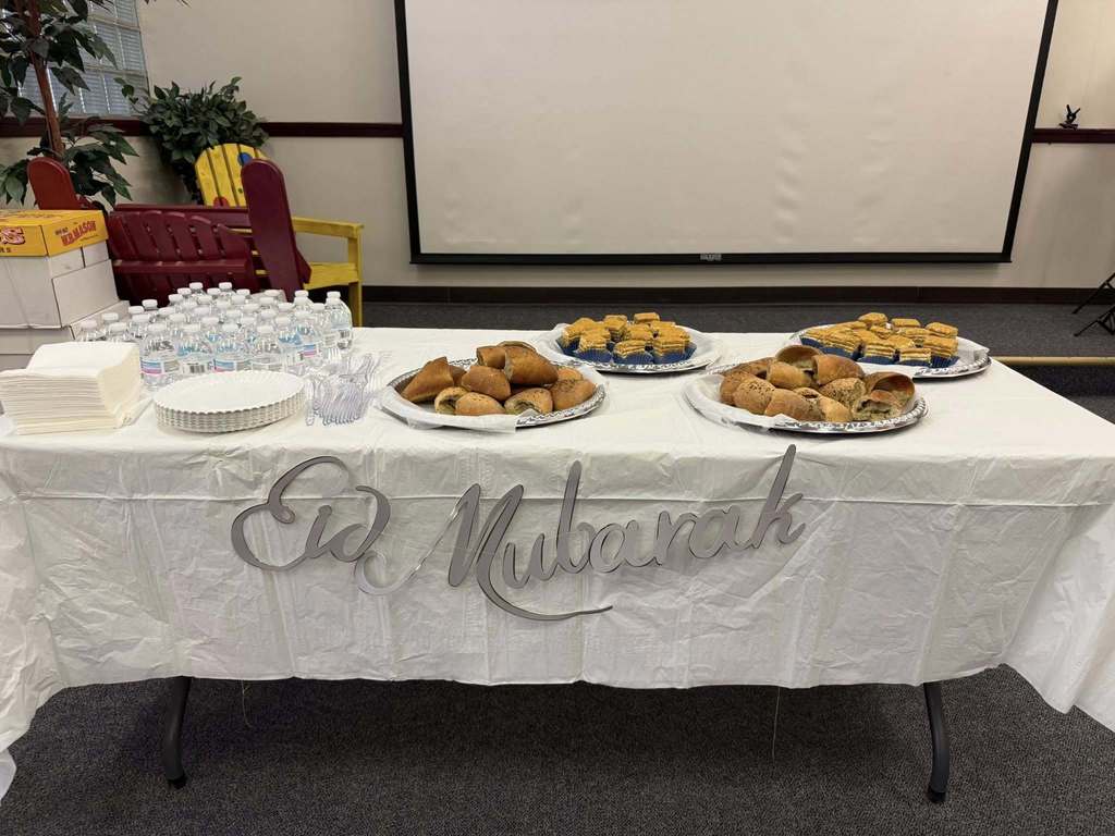 Food on a table that says "Eid Mubarek".