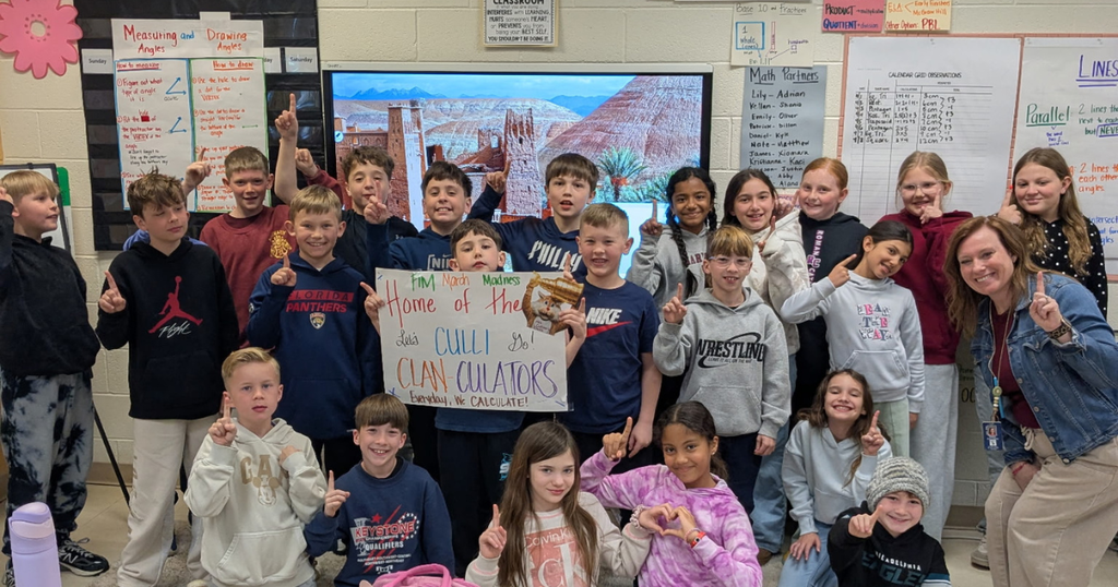 First in Math Students in a group celebrating their win