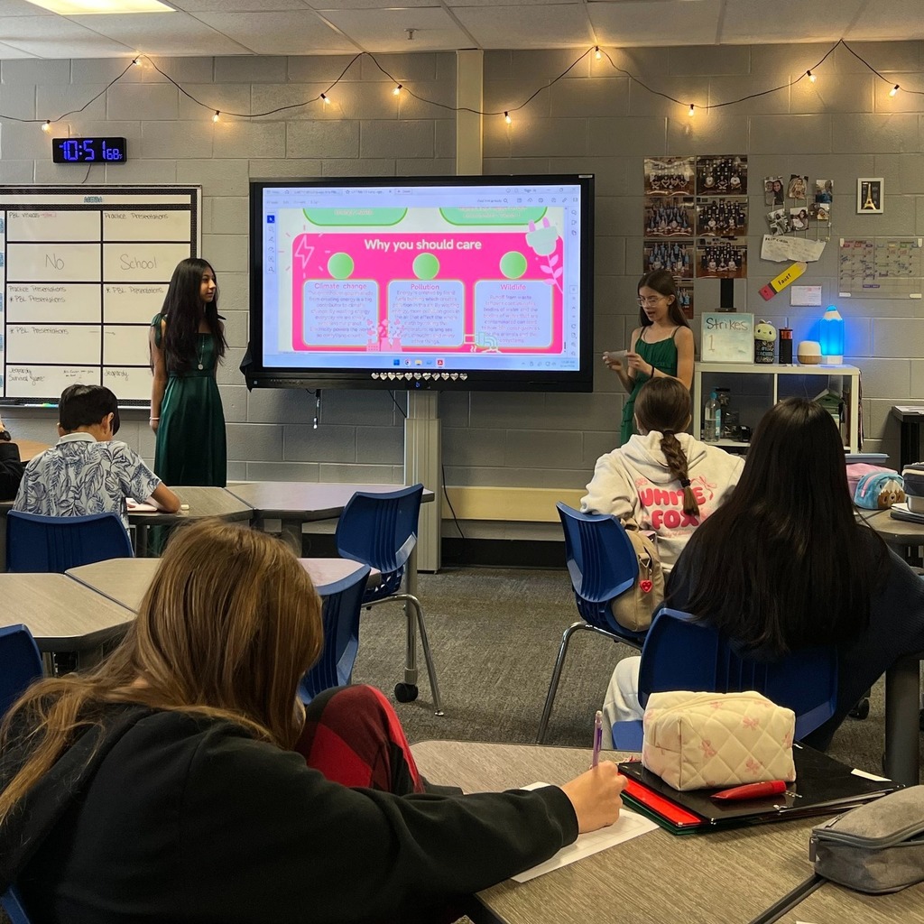 two students presenting to the class