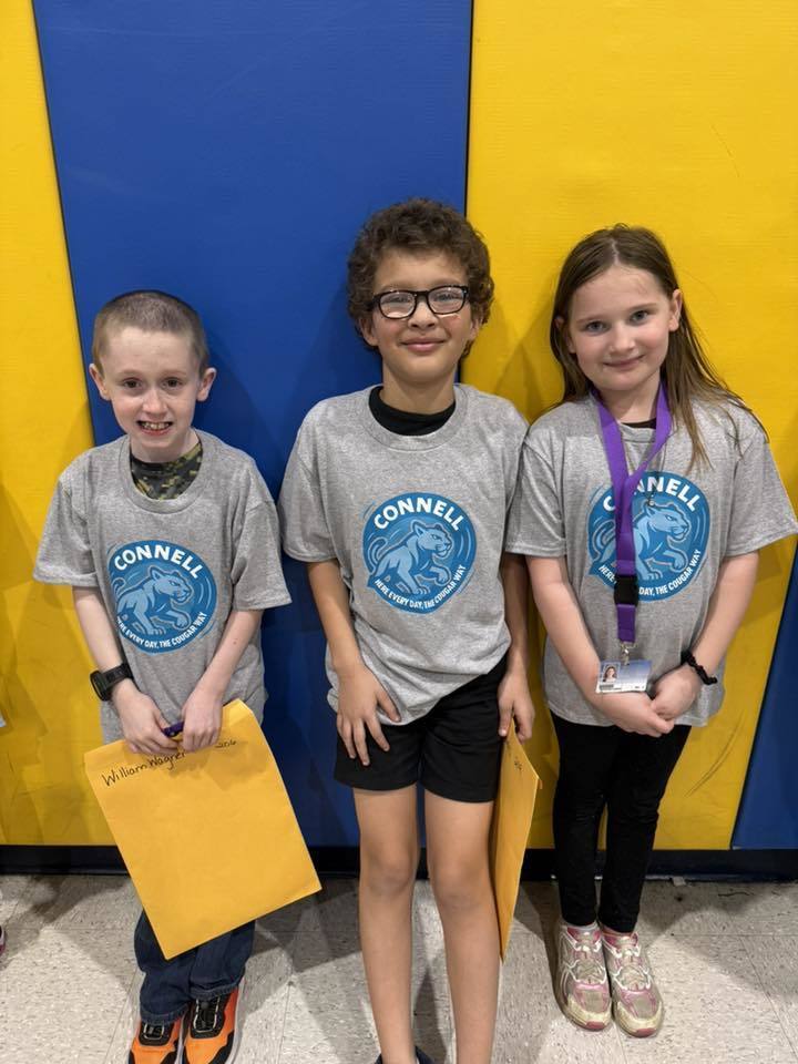 Students wearing matching, JoAnna Connell T-Shirts. 