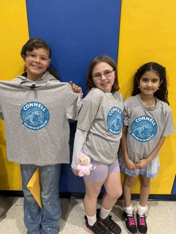 Students wearing matching, JoAnna Connell T-Shirts. 