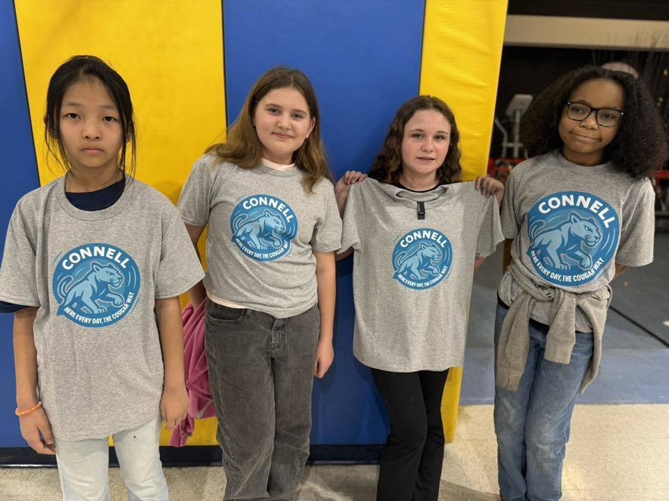 Students wearing matching, JoAnna Connell T-Shirts. 