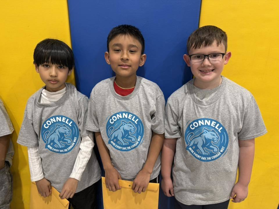 Students wearing matching, JoAnna Connell T-Shirts. 