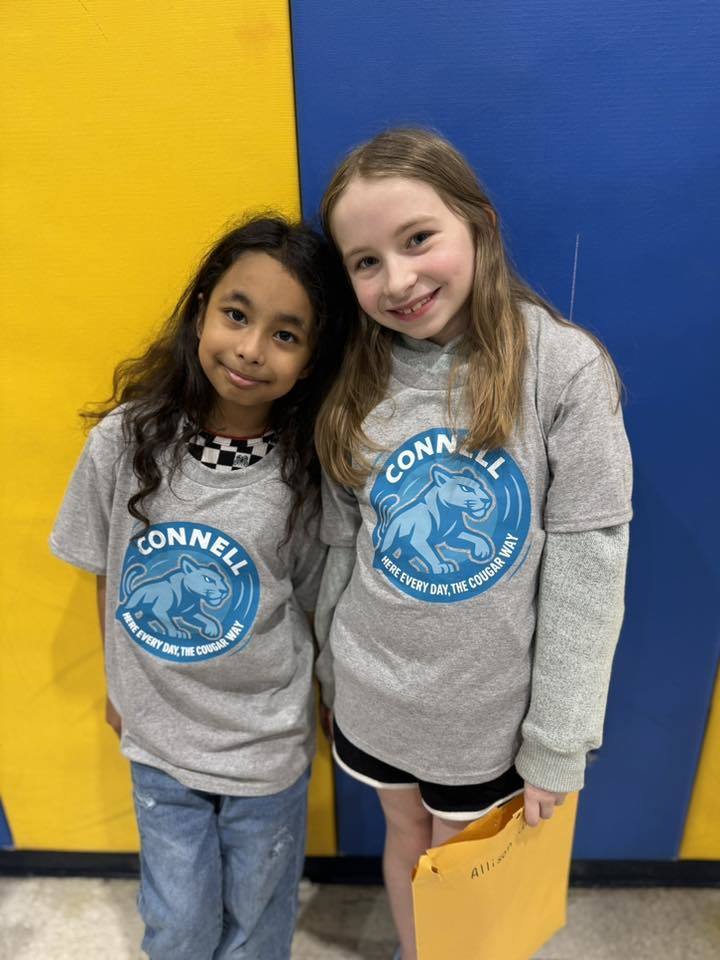 Students wearing matching, JoAnna Connell T-Shirts. 