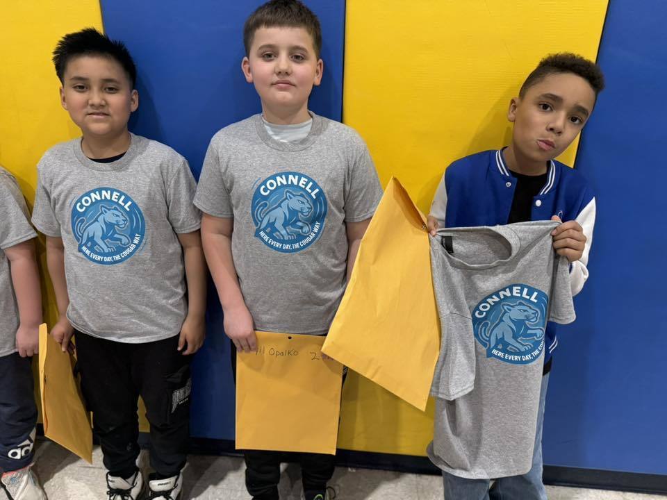Students wearing matching, JoAnna Connell T-Shirts. 