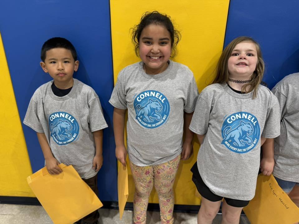 Students wearing matching, JoAnna Connell T-Shirts. 