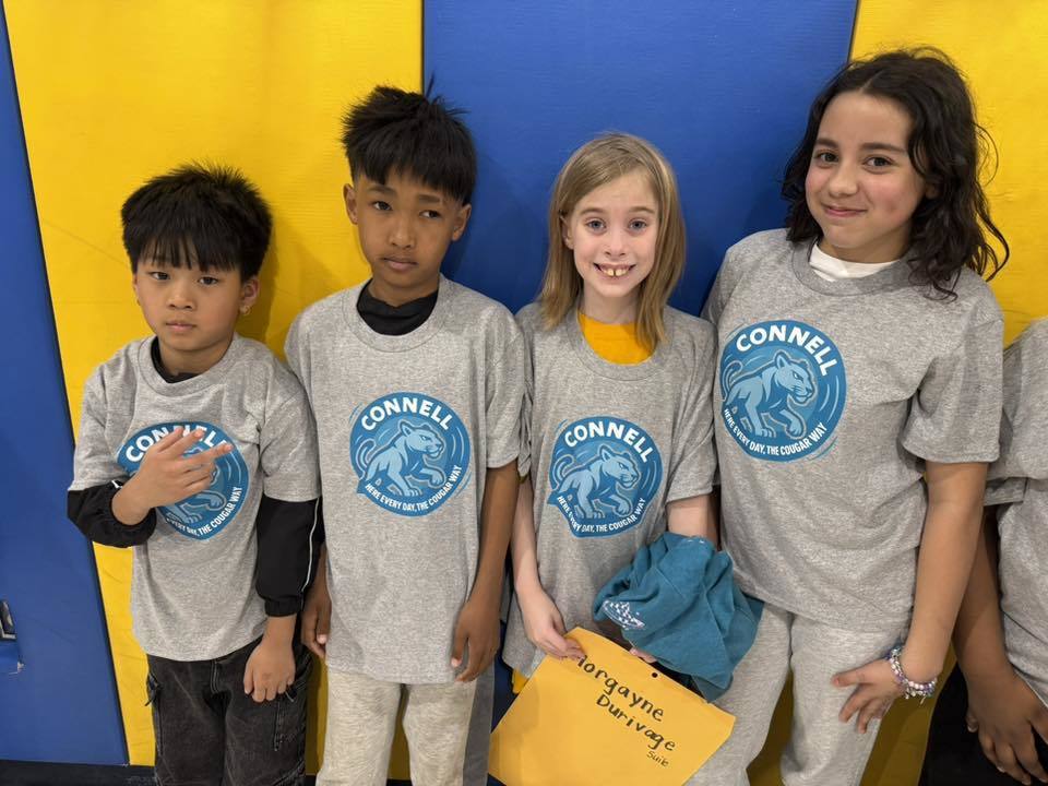 Students wearing matching, JoAnna Connell T-Shirts. 