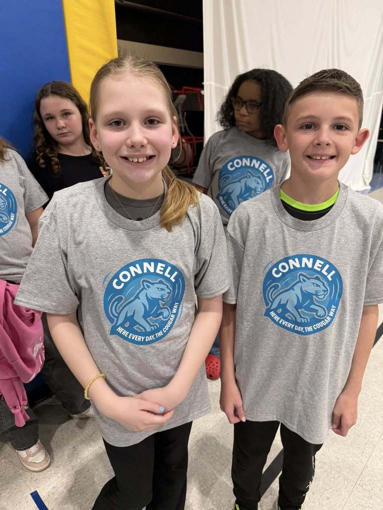 Students wearing matching, JoAnna Connell T-Shirts. 