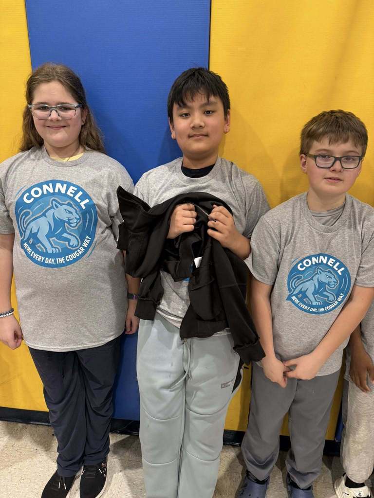 Students wearing matching, JoAnna Connell T-Shirts. 