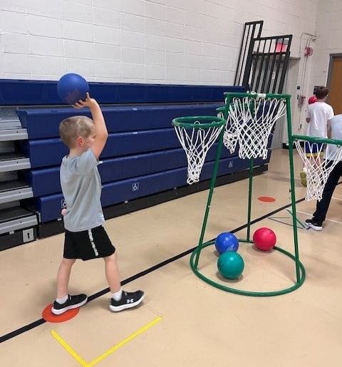 a student playing basketball