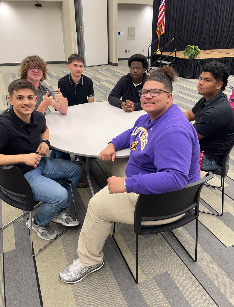 WOS students sitting at a table