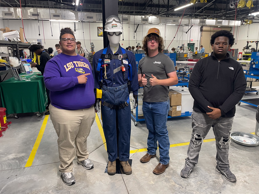 WOSHS students standing around a uniformed mannequin