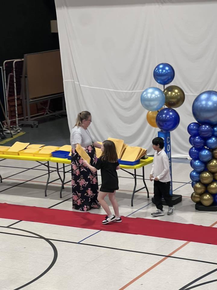 Students accepting their awards during the Awards assembly. 