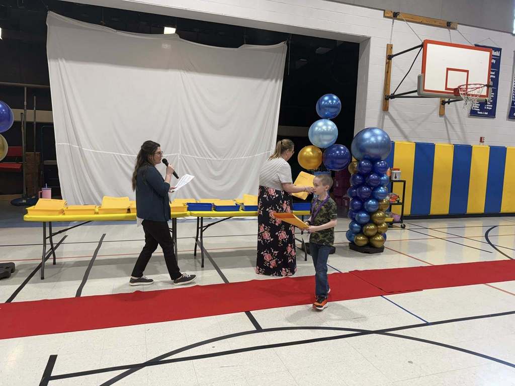 Students accepting their awards during the Awards assembly. 