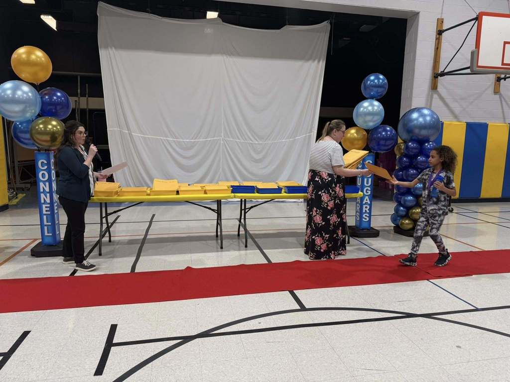 Students accepting their awards during the Awards assembly. 