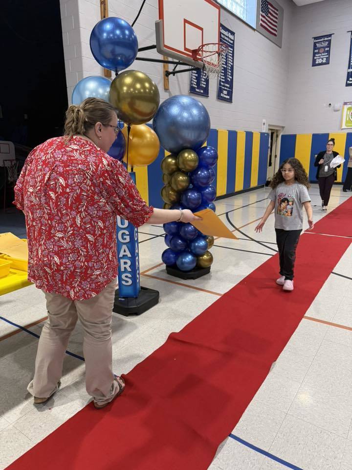 Students accepting their awards during the Awards assembly. 