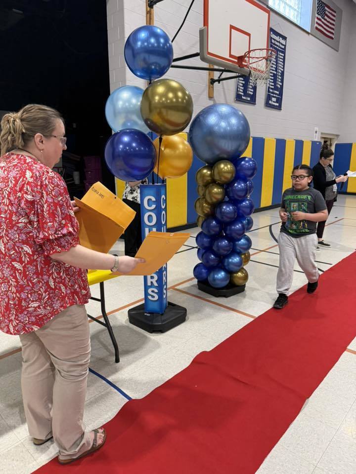 Students accepting their awards during the Awards assembly. 