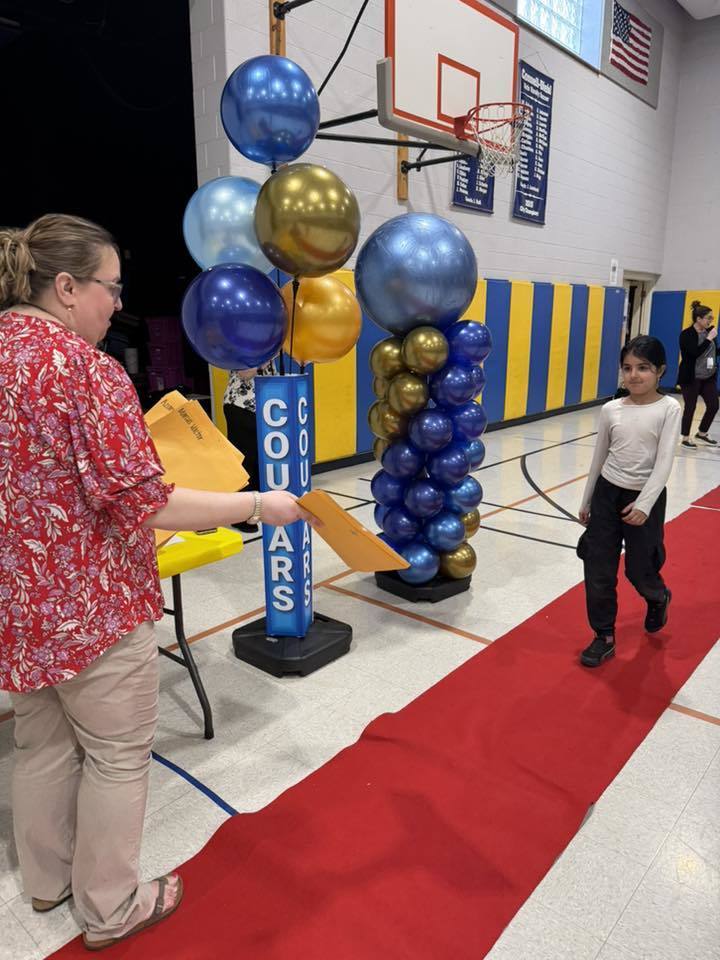 Students accepting their awards during the Awards assembly. 