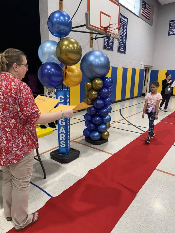 Students accepting their awards during the Awards assembly. 