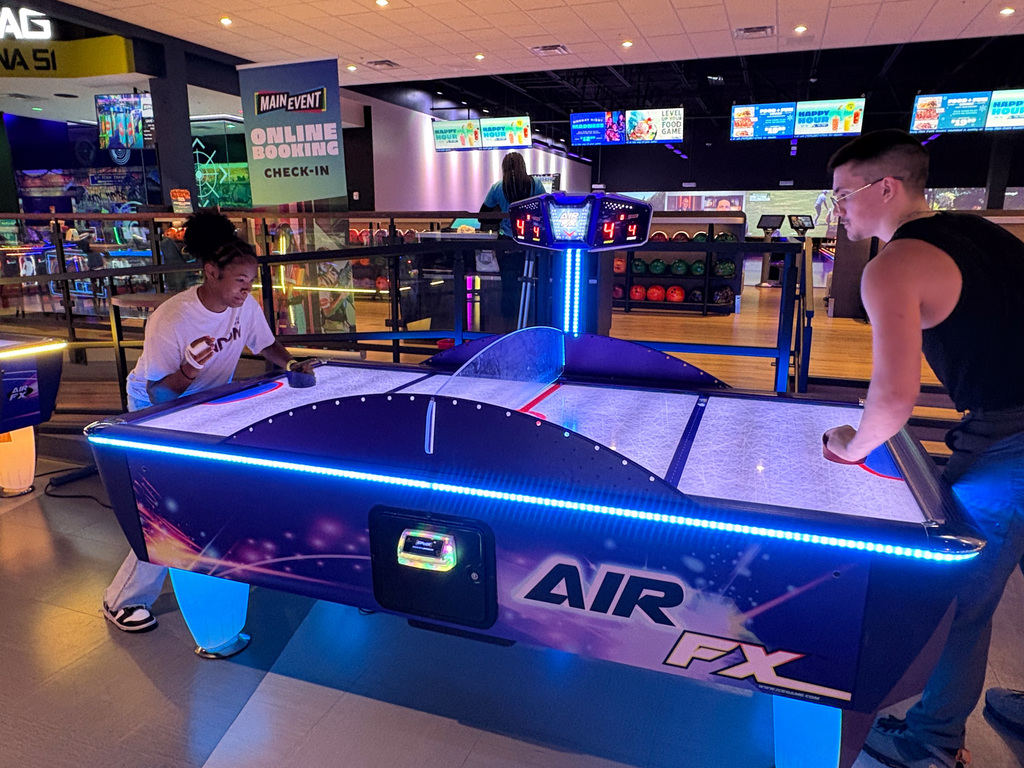 WOSHS student council members playing air hockey