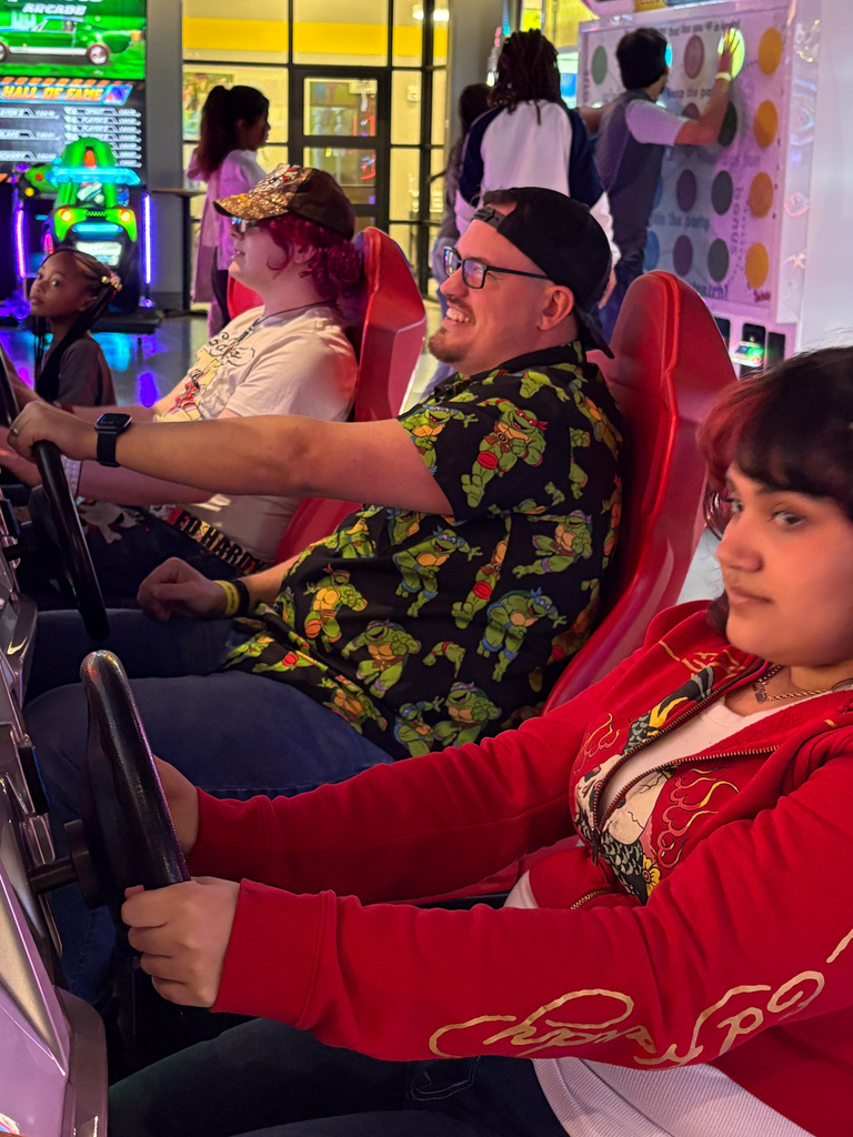 WOSHS student council members and teacher playing a racing game