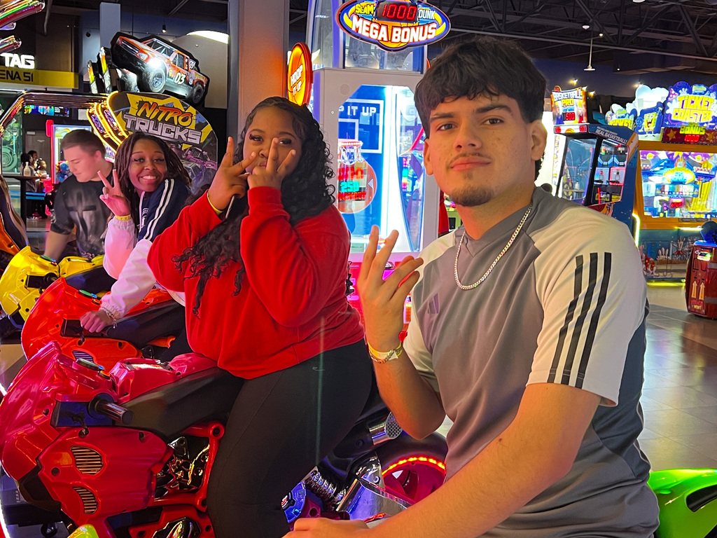 WOSHS student council members posing while playing a racing game