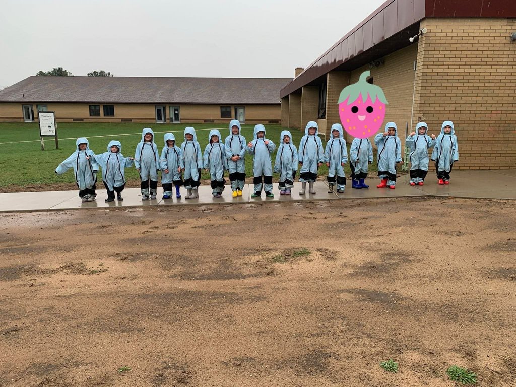 Preschool students in rain gear.