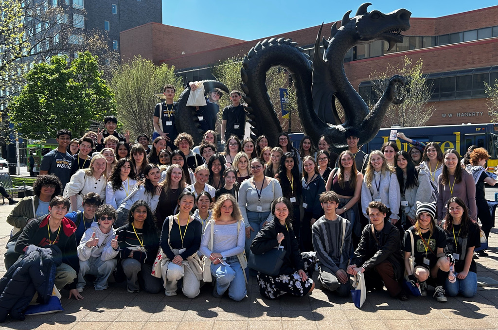 Students from AP Language course at Drexel University in front of the Dragon statue