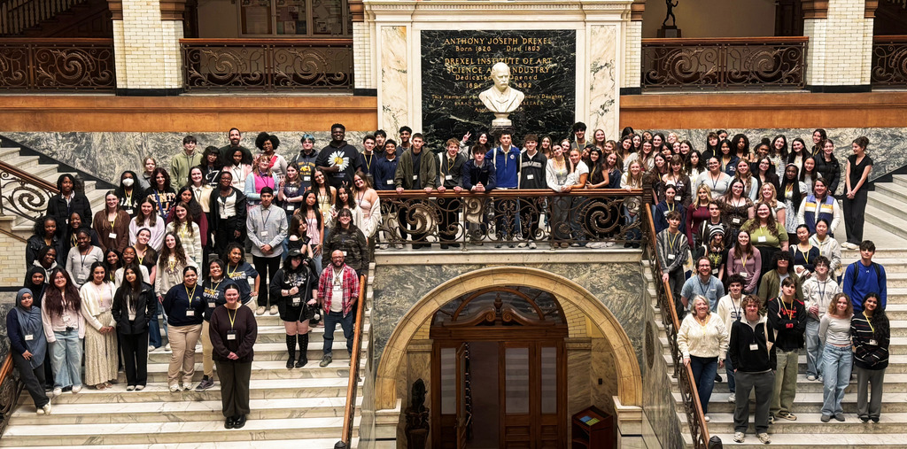 Students from AP Language course at Drexel University  on the stairs inside the building