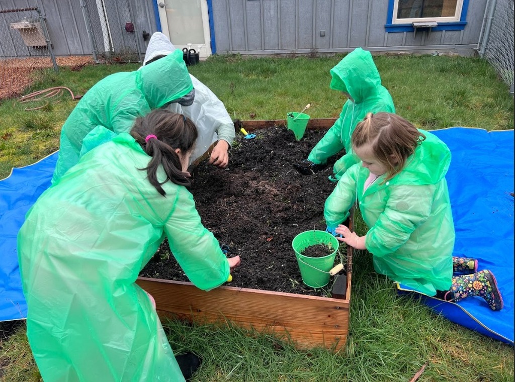 TK students preparing soil for planting.