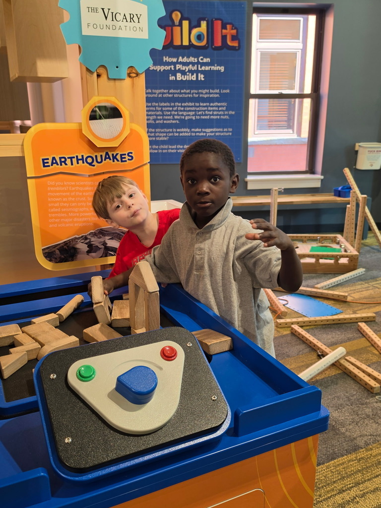 Students posing in a play room. 