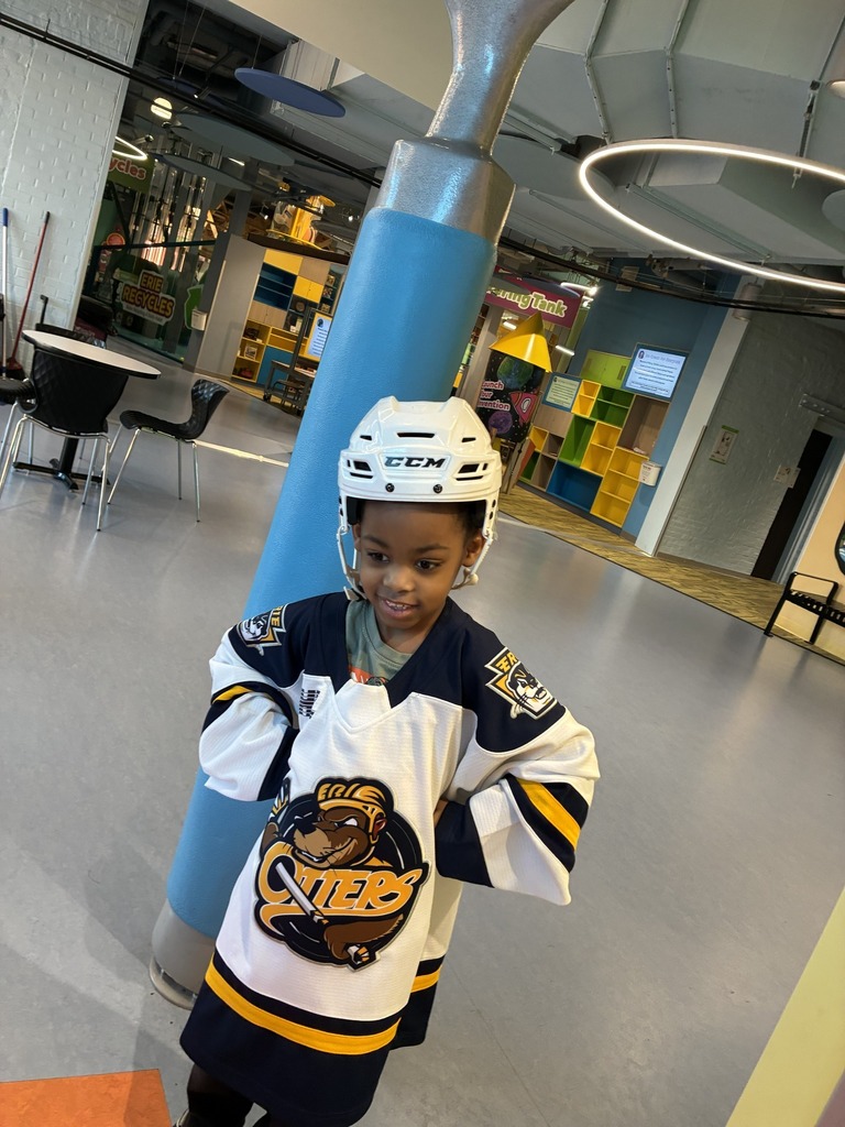 A student wearing an Erie Otters jersey and helmet. 