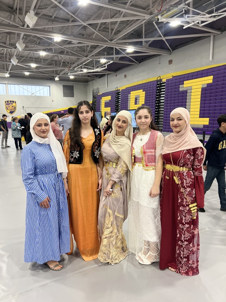 A group of young women dressed in cultural wear. 