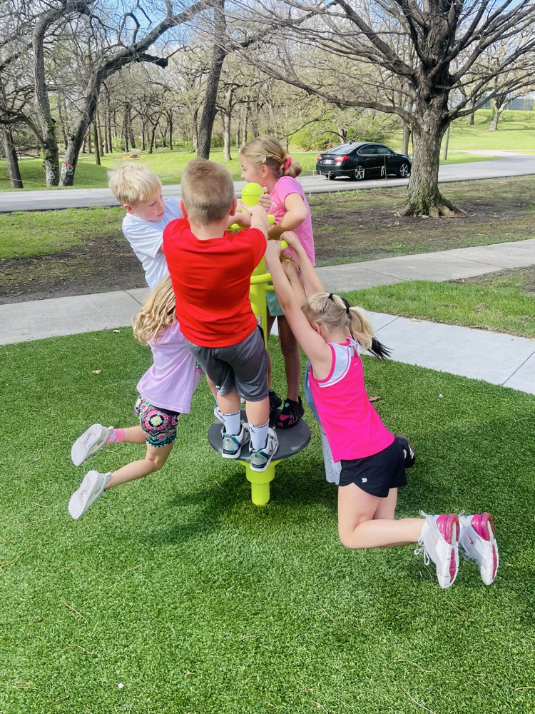 first graders playing at the park 