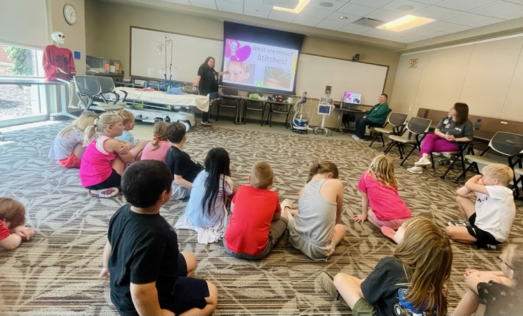 first graders listening to a nurse presentation 