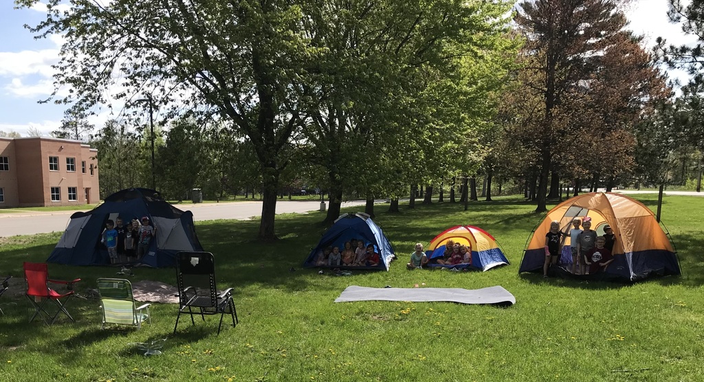 kids standing in tents