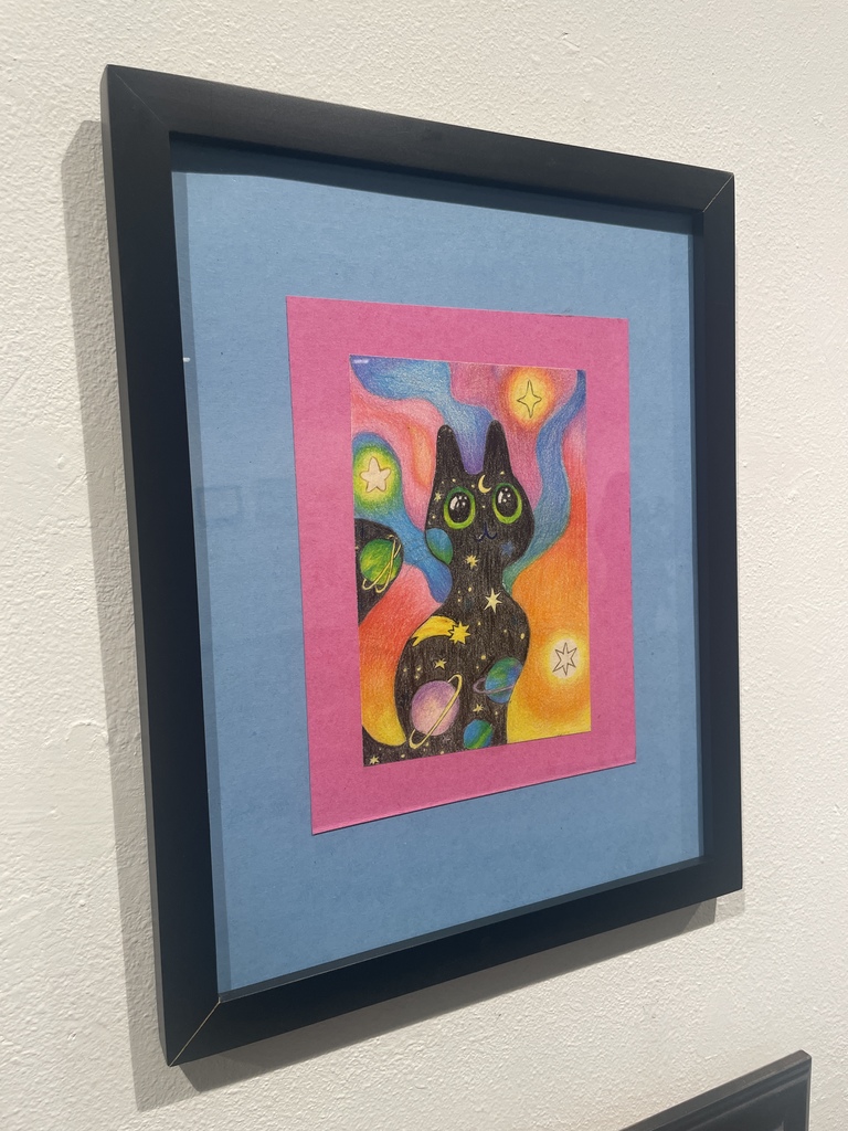 Colored pencil drawing of a cat with space pattern