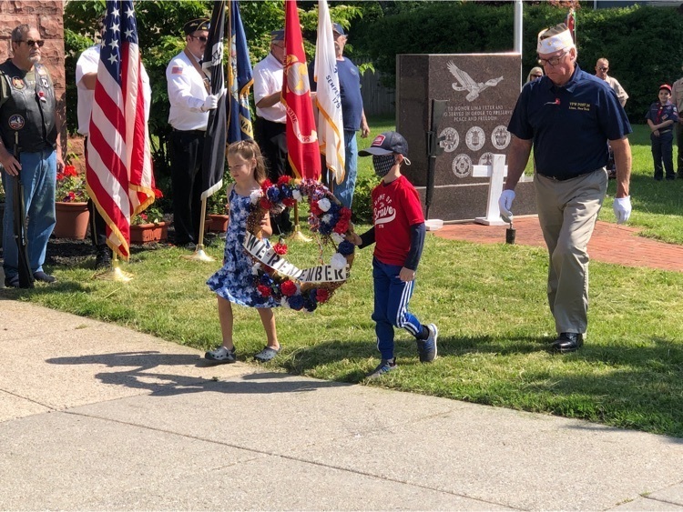 students presenting the flowers