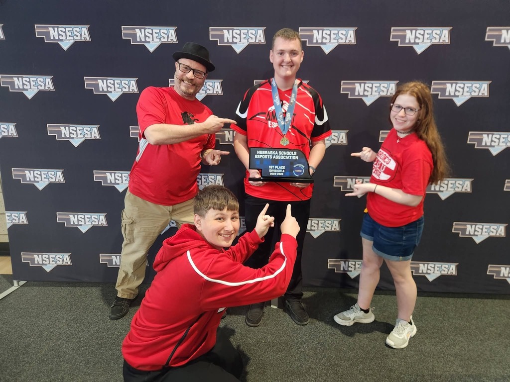 Image of Coach Josh Hughes, Landon Bickford holding his 1st place trophy