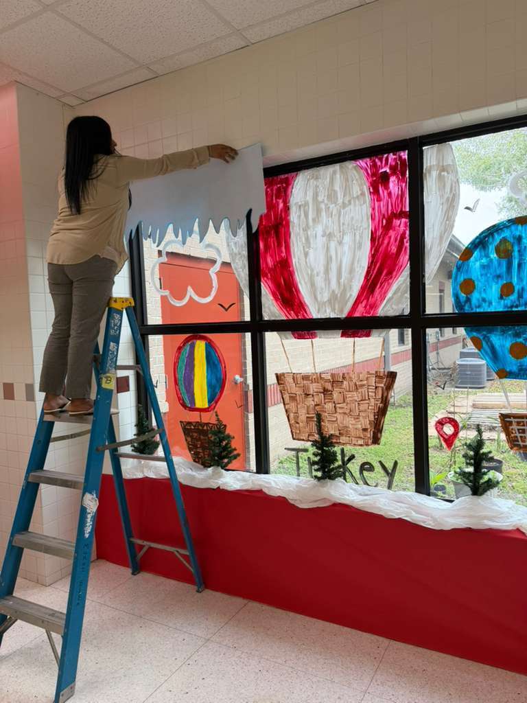 Woman brown sweater on ladder 