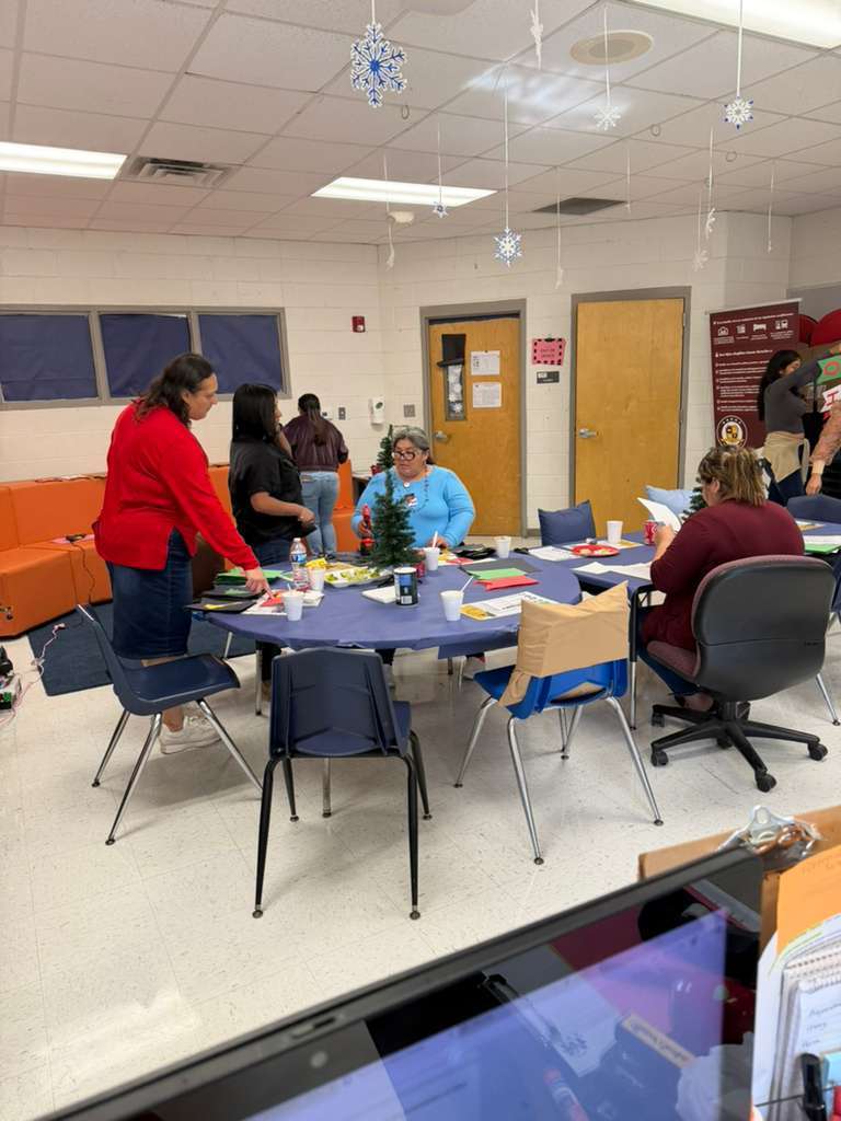 Women at table decorating 