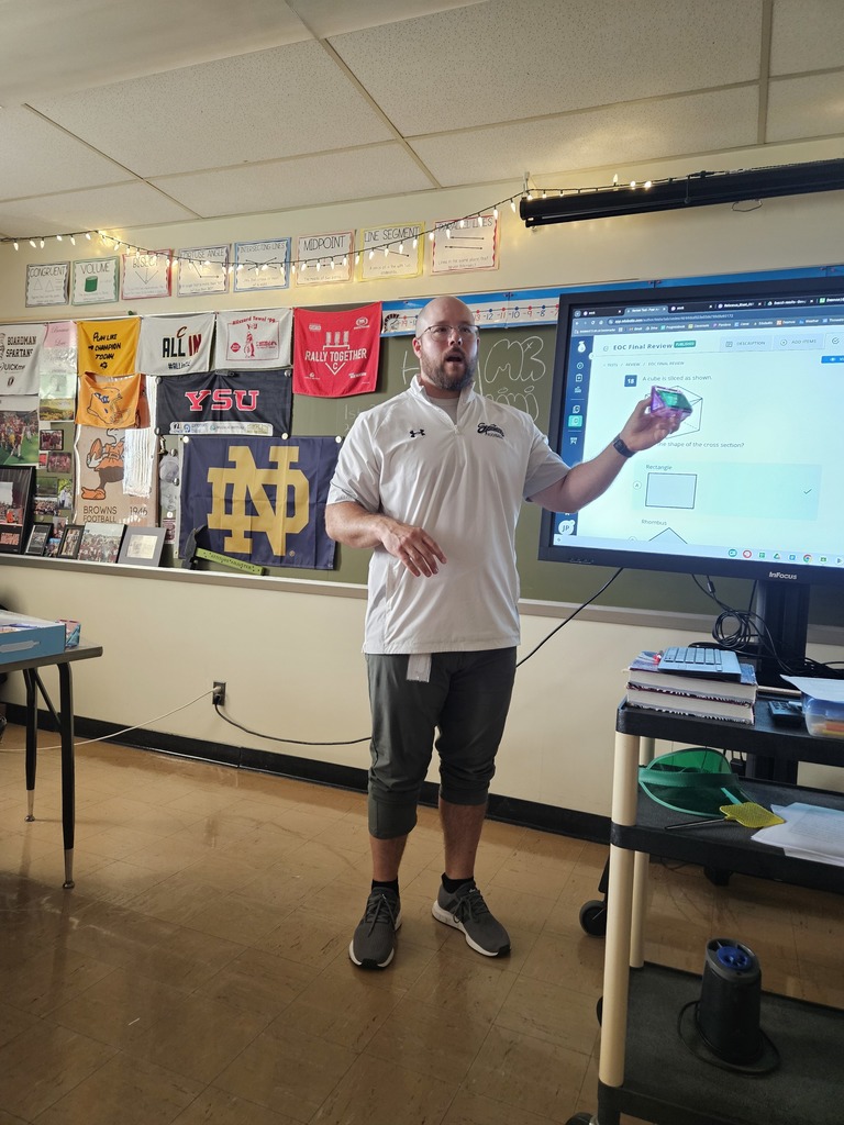 Mr. Pallini holds the picasso magnetic tiles as a half section of a cube
