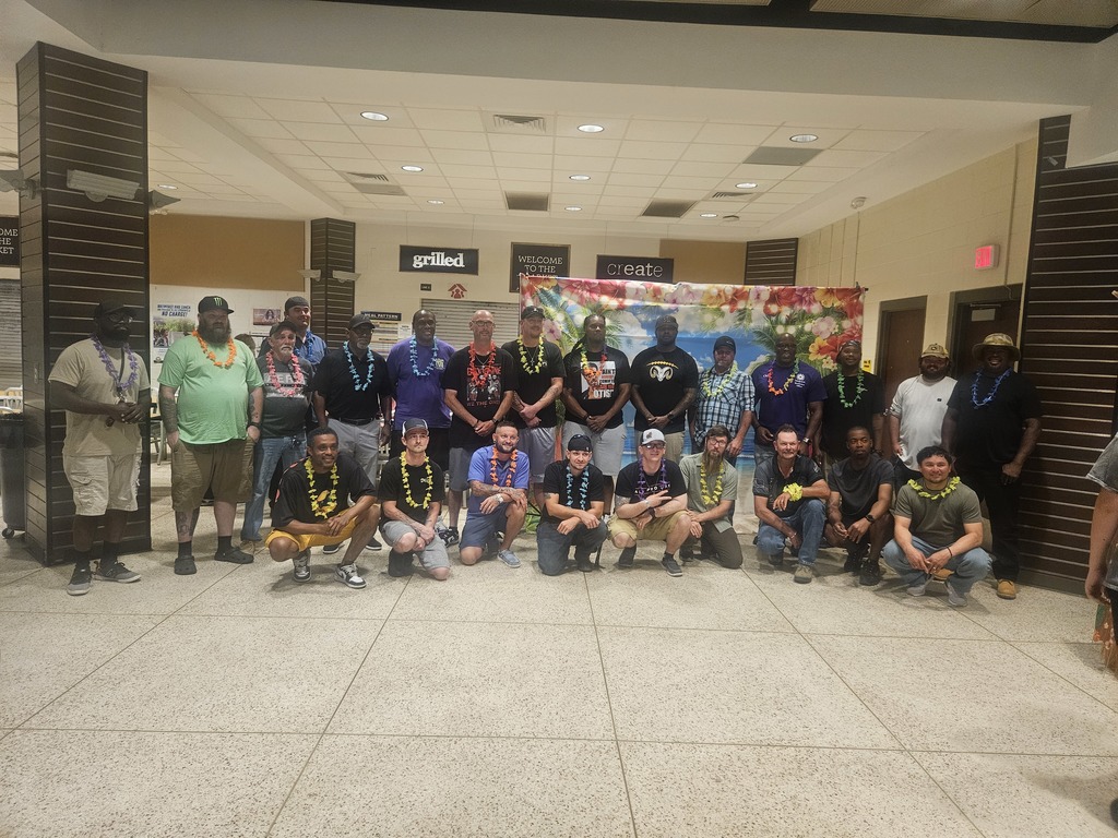 All Pro Dads pose for a photo