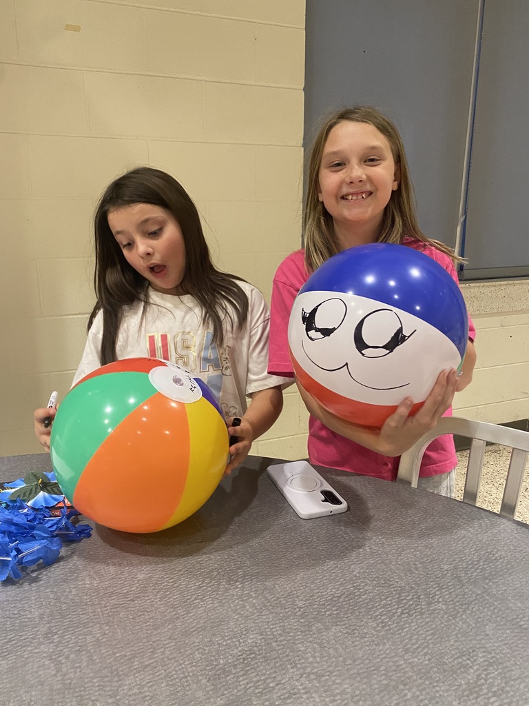Students decorate the beach balls that they later took home