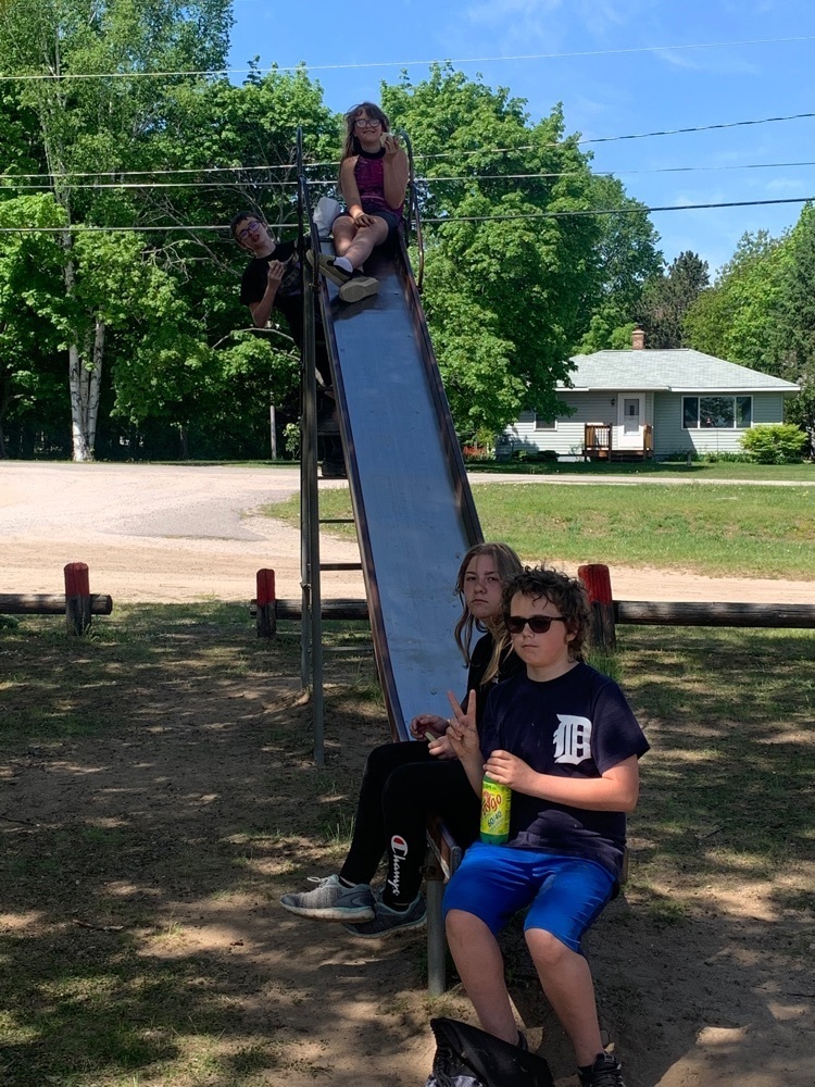 kids eating on the slide