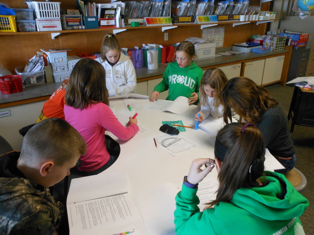 4th graders practice their own Reader's Theater scripts.