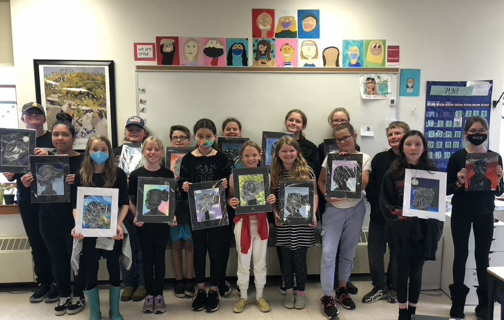 5th graders showing their art about Malaga Island